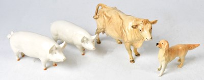 Lot 146A - BESWICK; a model of a Charolais cow, two pigs,...