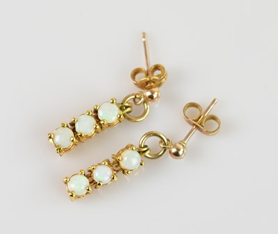 Lot 1405 - A pair of yellow metal pearl set drop earrings,...