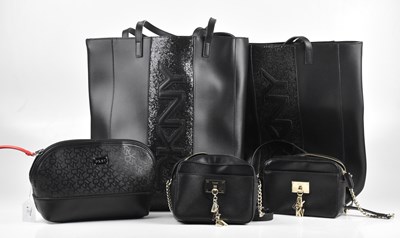 Lot 226 - DKNY; two large black tote bags, with front...