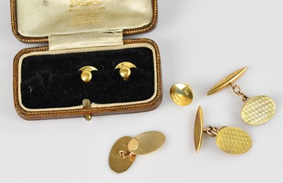 Lot 1448 - Three 18ct yellow gold studs, approximate...