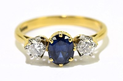 Lot 1064 - An 18ct yellow gold sapphire and diamond three...