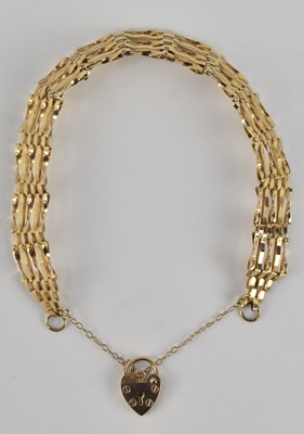 Lot 1457 - A 9ct yellow gold five bar gate bracelet,...