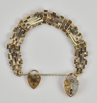 Lot 1449 - A two-tone 9ct gold five bar gate bracelet,...