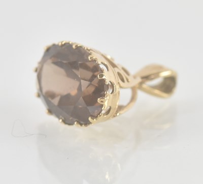 Lot 1289 - A 9ct yellow gold watch chain fob, with smoky...