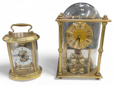 Lot 123 - A brass Acctim anniversary clock with glass...