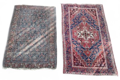 Lot 101 - A Persian style hand knotted red ground carpet,...