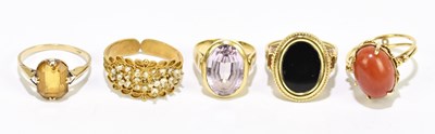 Lot 1048 - Four yellow metal dress rings, all stamped...