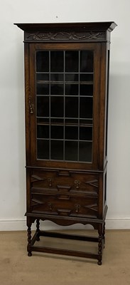Lot 838 - An oak display cabinet, the single door...