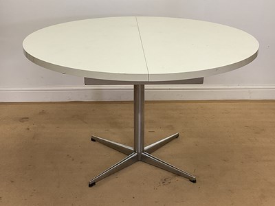 Lot 799 - PASTOE; a 1970s circular extending dining...