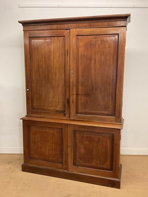 Lot 818 - A mahogany linen press with inlaid border...