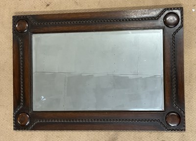 Lot 816 - An oak wall hanging mirror, with beaded...