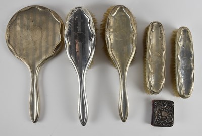 Lot 1184 - A George V hallmarked silver five piece...