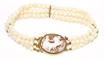 Lot 1253 - A cultured pearl three strand bracelet set...