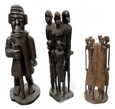 Lot 598 - Three African carved wooden figures comprising...