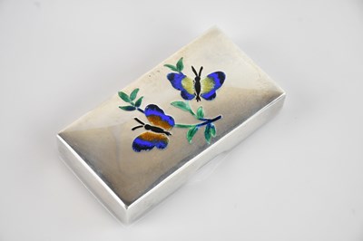 Lot 447 - RAVISSANT; a white metal and enamel...