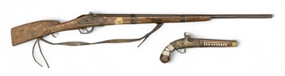 Lot 354 - A decorative Middle Eastern rifle, overall...