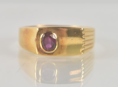 Lot 1300 - An 18ct yellow gold ruby set signet ring, the...