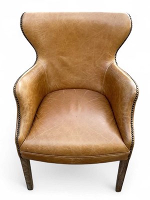 Lot 82 - A modern brown leather button upholstered...