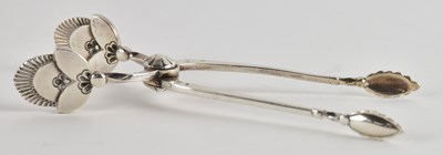 Lot 1243 - GEORG JENSEN; a pair of small 925 silver sugar...