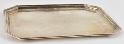 Lot 1205 - A white metal tray with cut corners and...