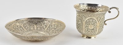 Lot 1241 - A Middle Eastern silver teacup and saucer...
