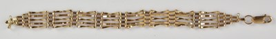 Lot 1455 - A 9ct yellow gold five bar gate bracelet,...