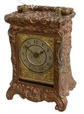 Lot 125 - A small brass cased travel carriage clock in a...