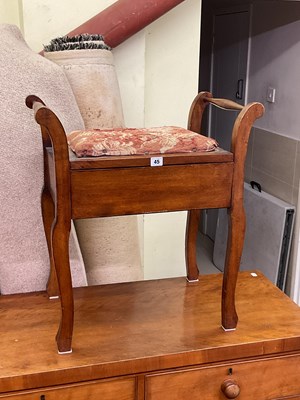 Lot 45 - A mahogany piano stool with upholstered seat...