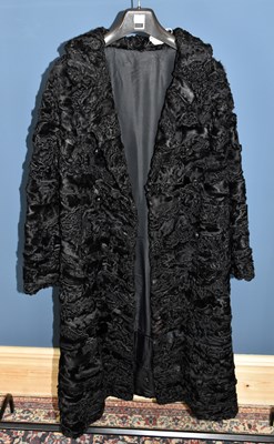 Lot 851 - A vintage black Persian lamb full length lined...