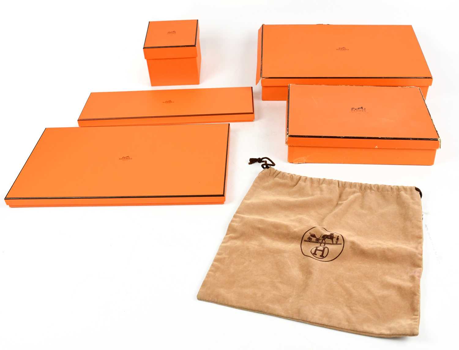Lot 810 - HERMÈS; five empty branded boxes and a tan
