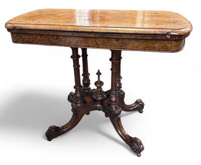 Lot 83 - A Victorian walnut and inlaid fold-over card...