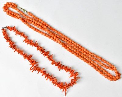 Lot 1283 - Two pink coral necklaces (2).