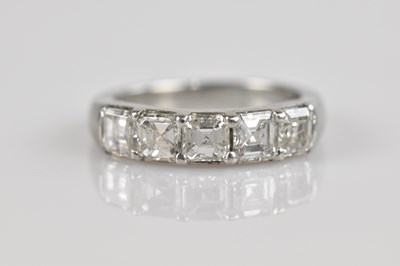 Lot 2254 - A platinum five stone diamond dress ring, set...