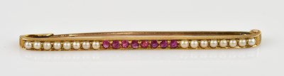 Lot 1322 - A Victorian style seed pearl and ruby bar...