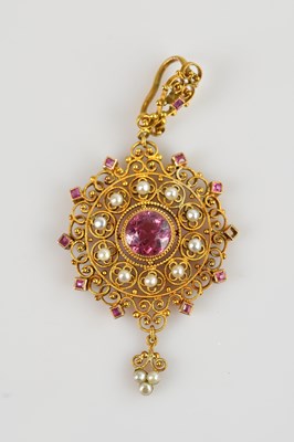 Lot 2126 - A yellow metal filigree pendant set with pink...