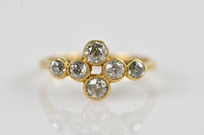 Lot 2356 - An 18ct yellow gold diamond six stone dress...