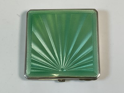 Lot 37 - An Art Deco green guilloche enamel compact...
