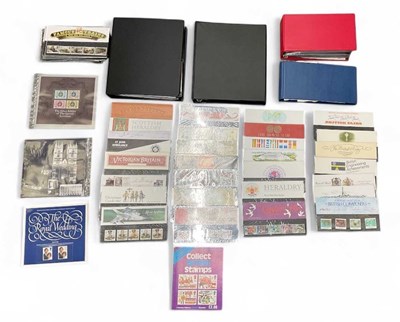 Lot 440 - Two albums of first day covers, an album of...