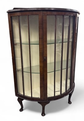 Lot 80 - A 1920s/30s Art Deco walnut bowfront display...
