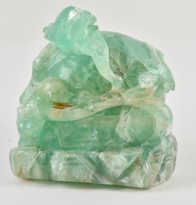 Lot 1087 - A Chinese carved green fluorite figure of a...