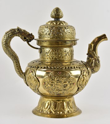 Lot 1065 - A large Tibetan brass teapot, with figural...