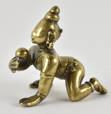 Lot 1083 - A small Indian gilt bronze figure of Krishna...