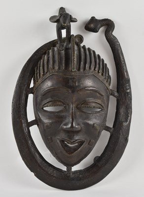 Lot 1062 - An Indian tribal Tantrik bronze mask,...