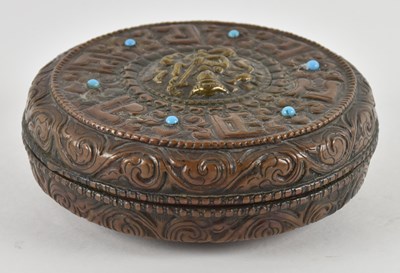 Lot 1061 - A 19th century Tibetan copper circular...