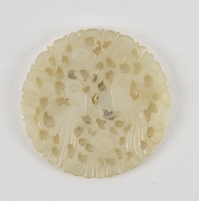 Lot 1041 - A Chinese pierced white jade bi disc,...
