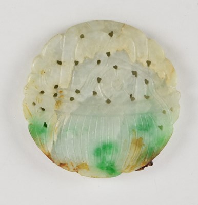 Lot 1042 - A Chinese white and green jade pierced bi disc,...