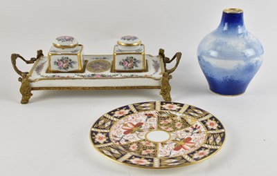 Lot 546 - LIMOGES; a Continental hand painted floral...