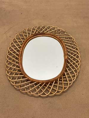 Lot 931 - A woven bamboo oval wall mirror, 80 x 66cm.