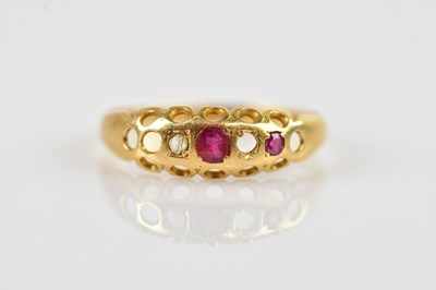Lot 2592 - An 18ct yellow gold diamond and ruby dress...