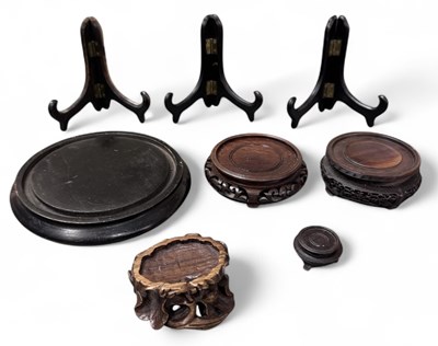 Lot 1095 - Five Chinese carved hardwood stands, including...
